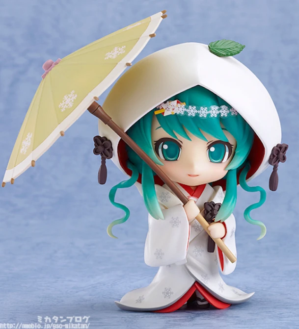 an anime doll with blue hair and green hair, holding an umbrella
