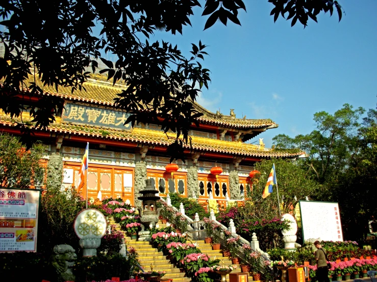 a beautiful pagoda building with floral decorations on it