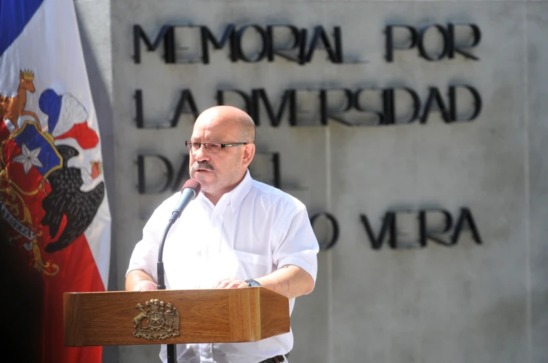 the man is giving a speech on his memorial