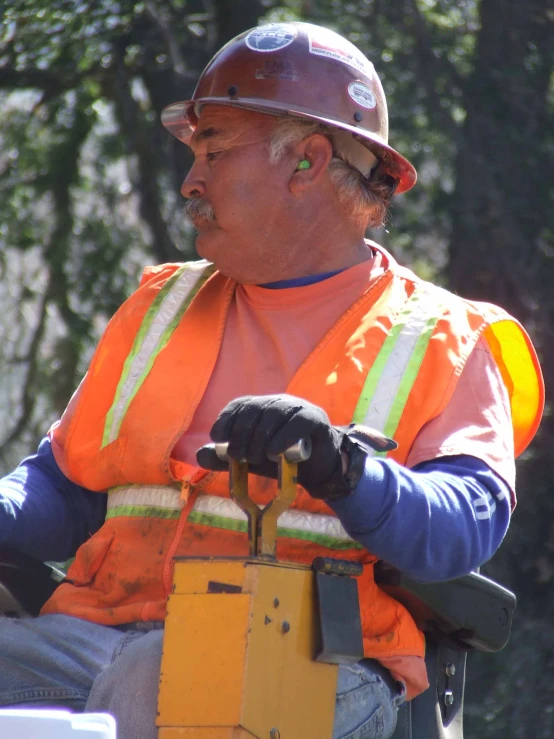 a man in safety gear driving an enclosed vehicle