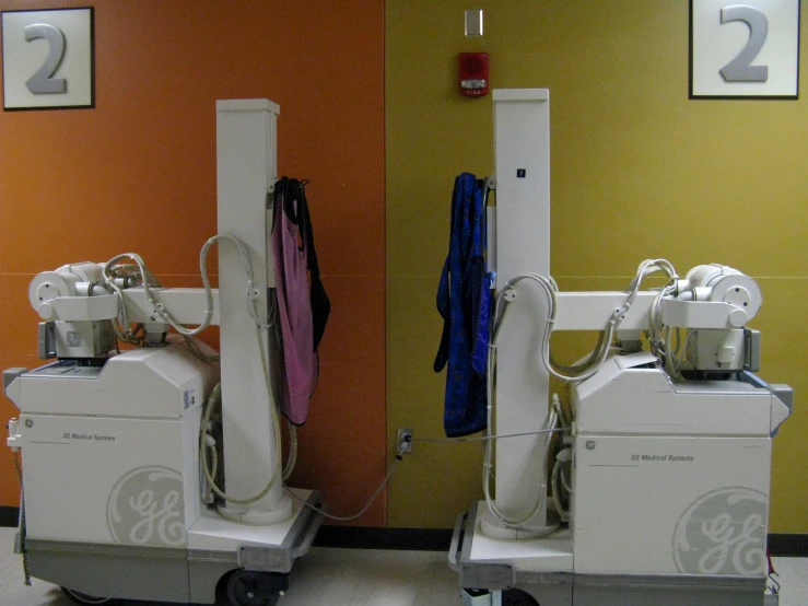 two machines that are sitting in a room