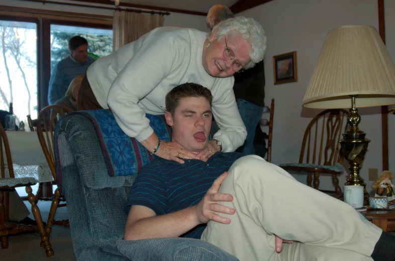 an older man being carried on the back of a young man