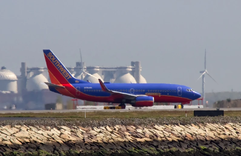 a jumbo jet jetliner taking off from an airport runway