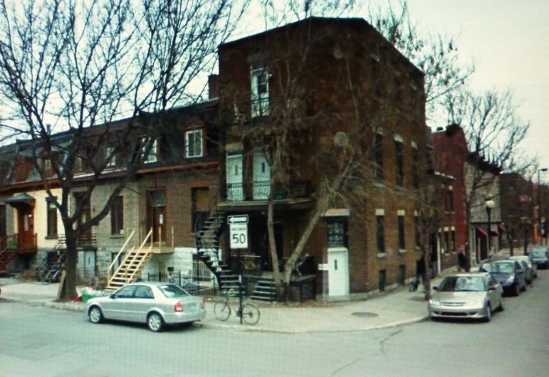 a building in an old city area with fire escapes