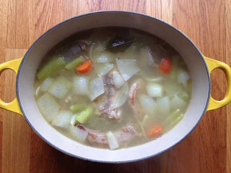 a stew in a bowl with some vegetables