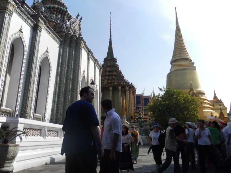 a group of people standing outside a building