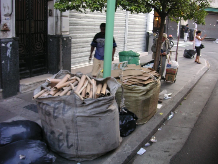 a man that is standing near a bag