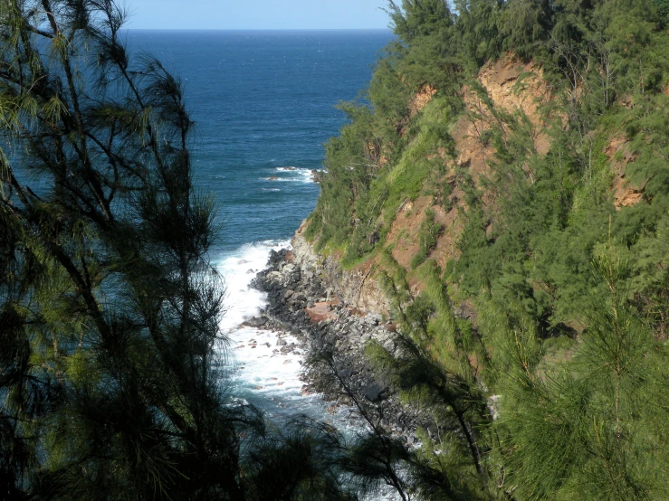 the view from a cliff in the middle of the ocean