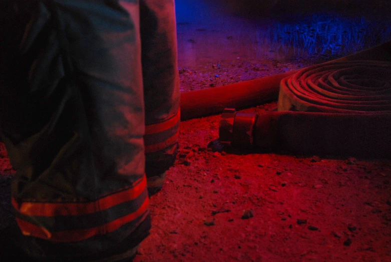 red light emitting on pipes and a fire hydrant