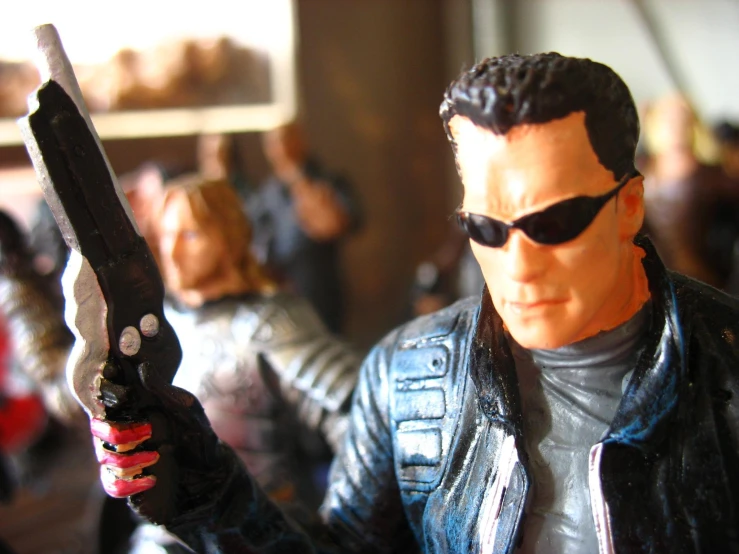 a toy figure is shown holding a knife