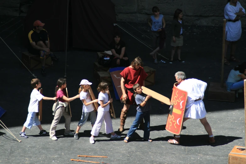 a group of people are playing tug of war