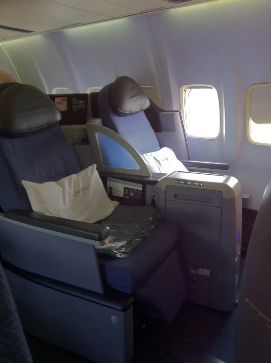 there is a seat on an airplane with the tv