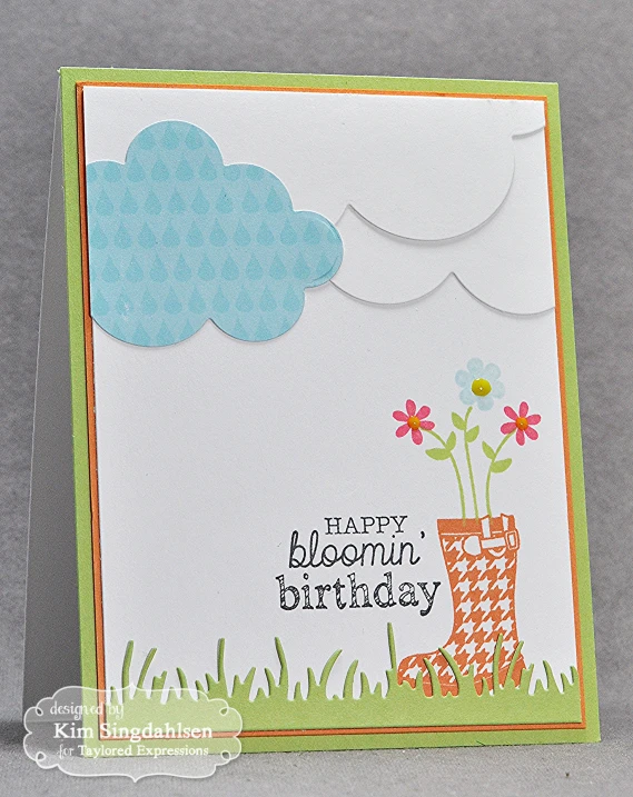 a card with a boot and flowers in it