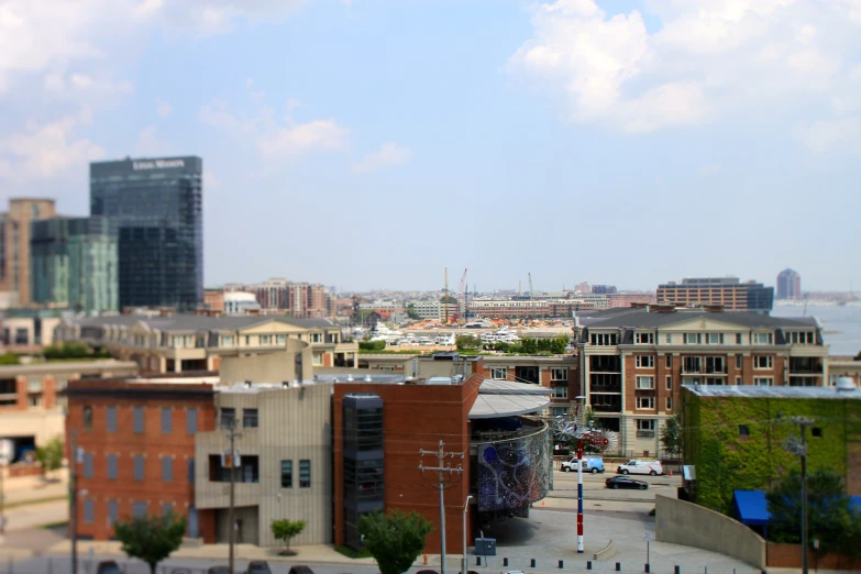 a city view of a river, cars and buildings