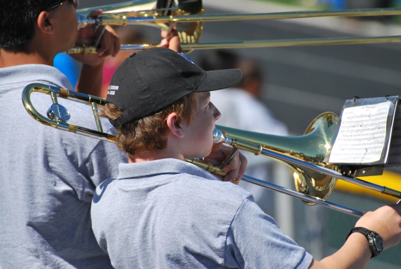 a boy playing the trombone for the band