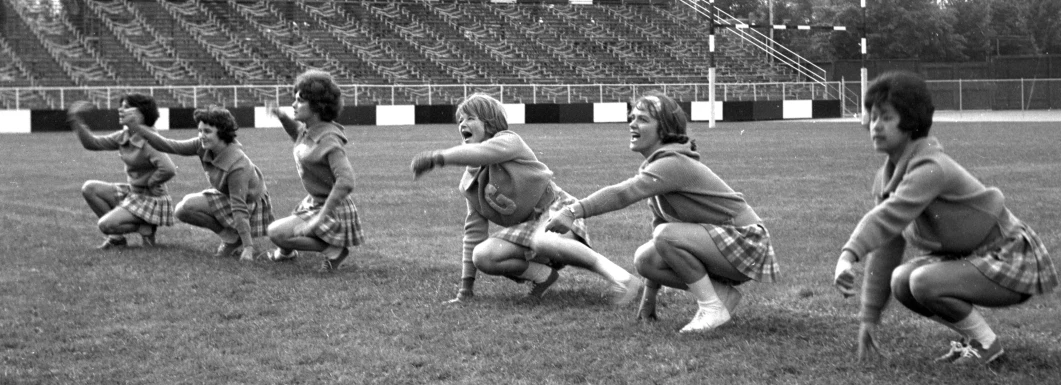 some people playing a game of frisbee on a field