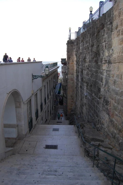 a view down the steps in the middle of a sidewalk