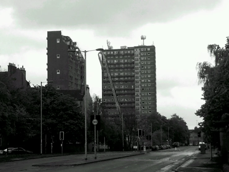 black and white image of street in urban setting