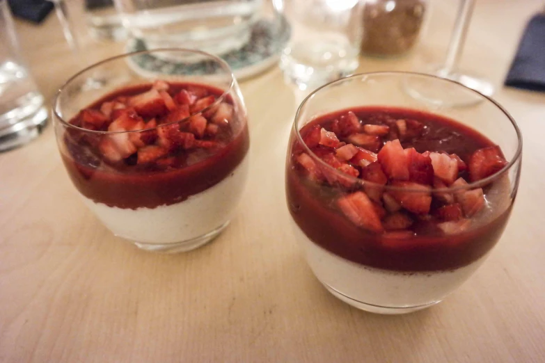 two small bowls of desserts on a table