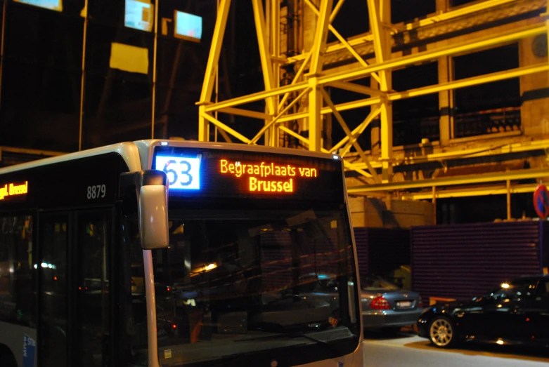 a city bus stopped in a crowded city street