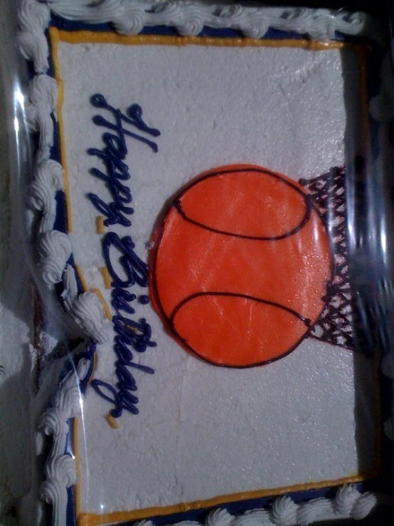 the birthday cake is decorated with an orange basketball ball