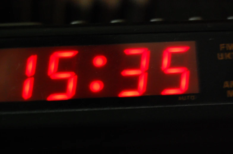 an analog clock showing the time 535 pm