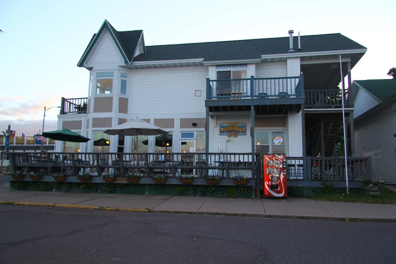 a house with some patio furniture in front of it