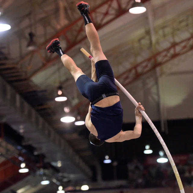 a pole walker is mid air above the ground