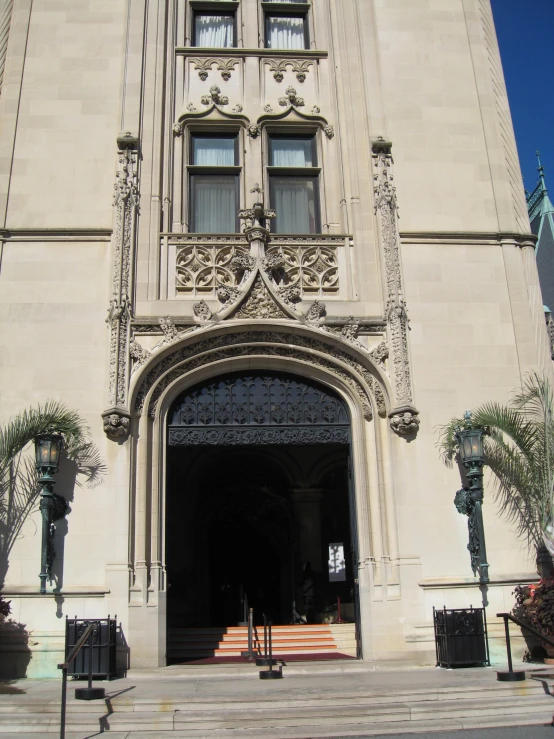 a tall building with ornate doorways and carved ornaments