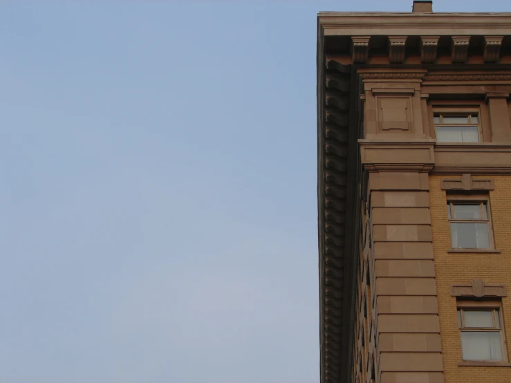 a very tall building with clocks attached to it