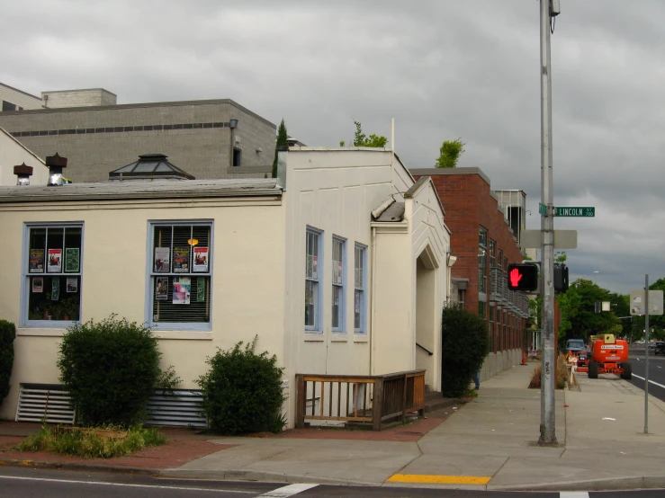 the corner of a city street with some very pretty houses