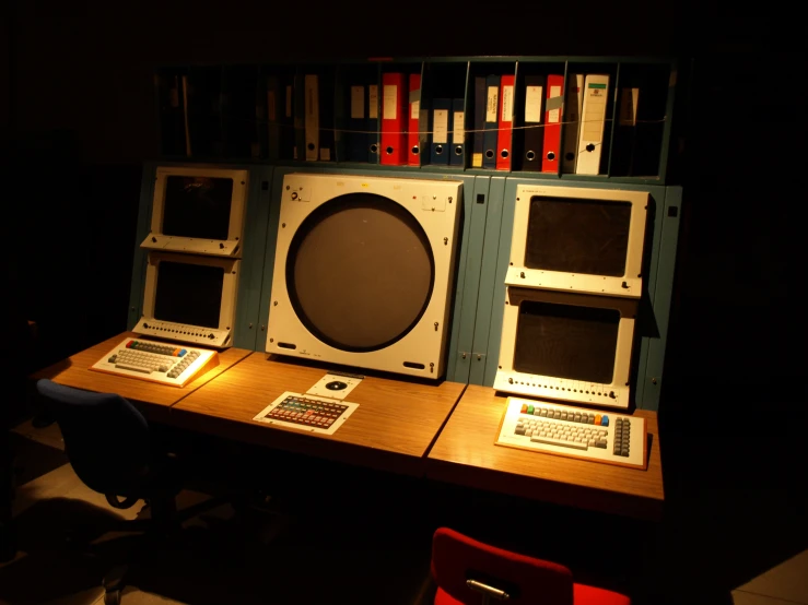 electronic equipment displayed on wooden table at dark room