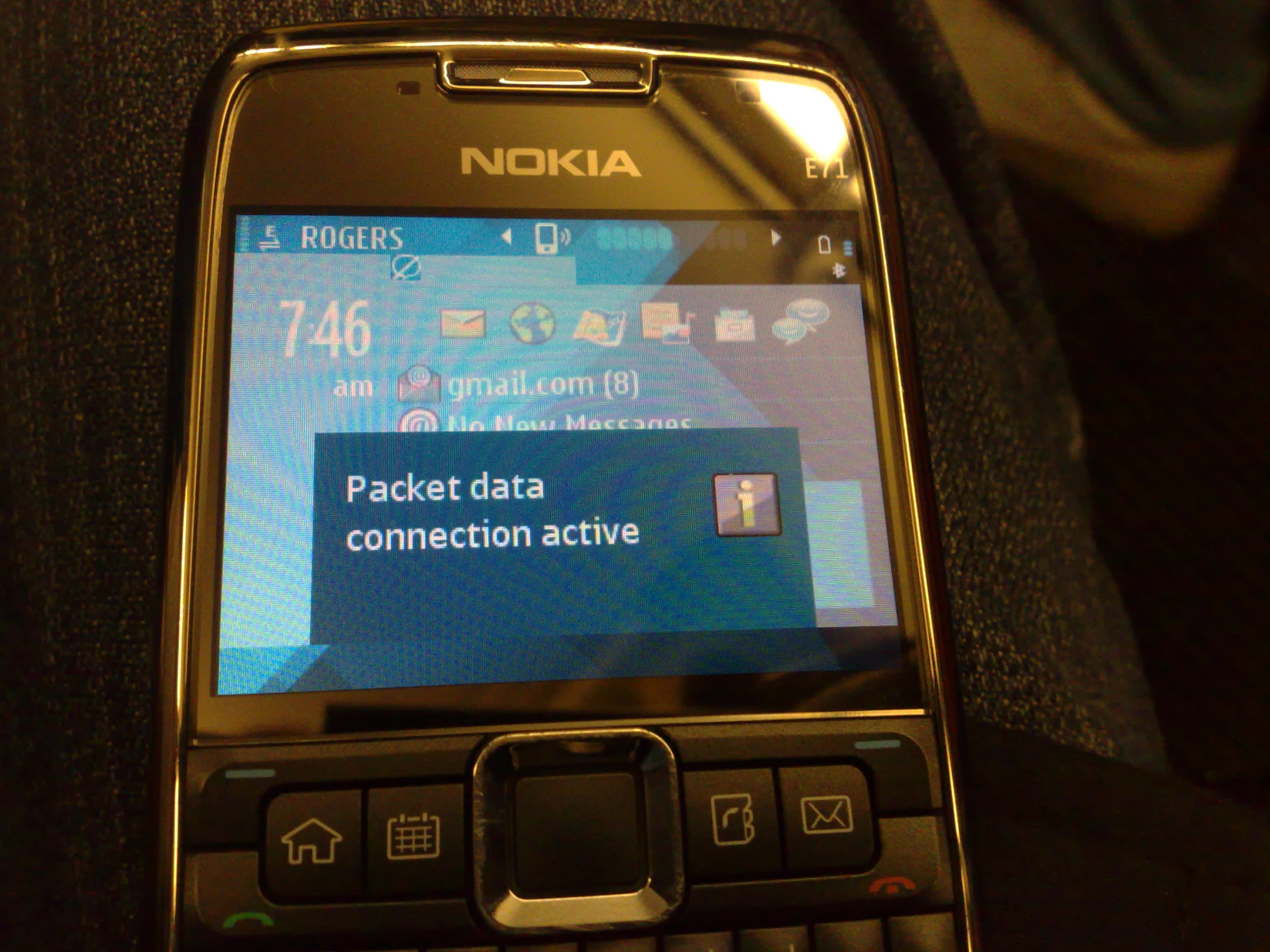 a nokia cell phone with the text packet data connection active