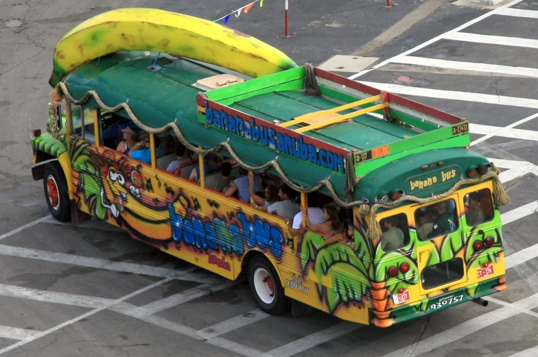 a bus that has people inside driving down the road