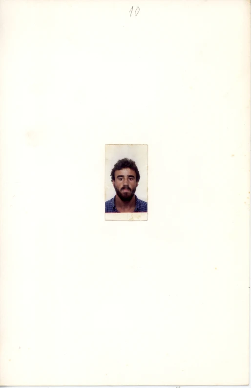 a white polaroid pograph of a man's face