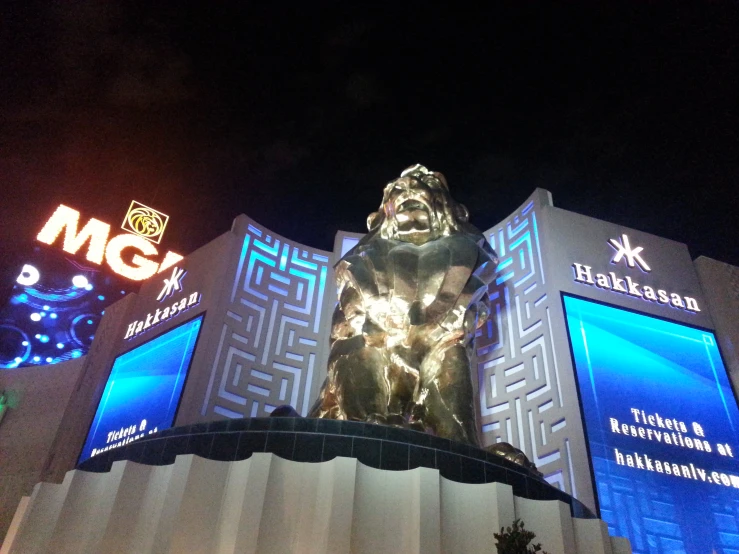 a large gold gorilla statue in front of mgm music