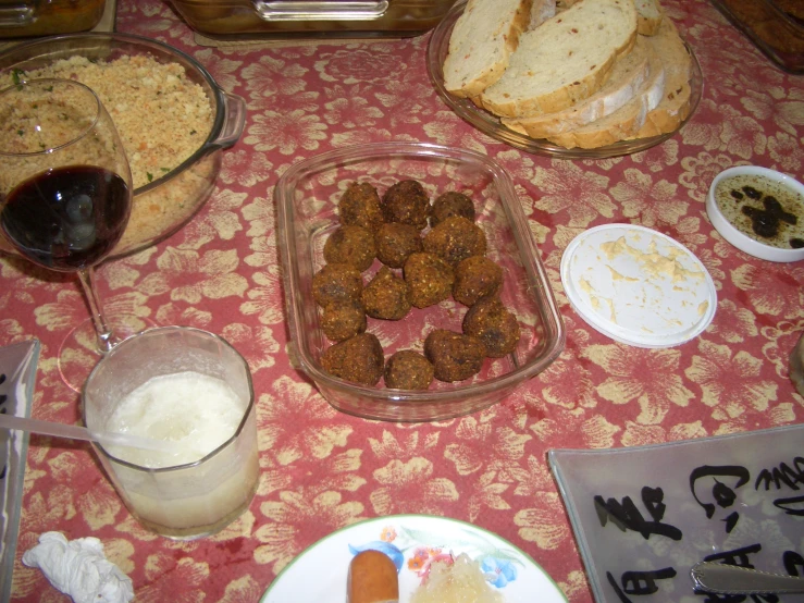 this is a table filled with dishes and breads