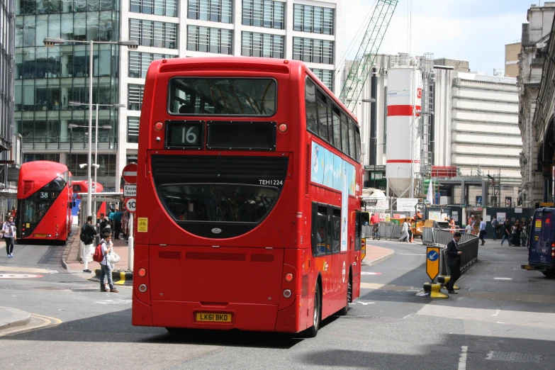 a double decker bus traveling down the street