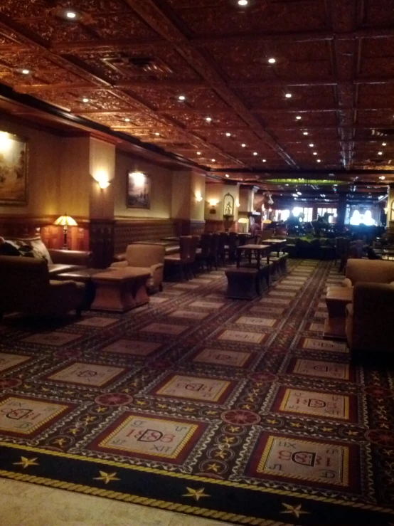 a lobby with seating areas and carpeted floors