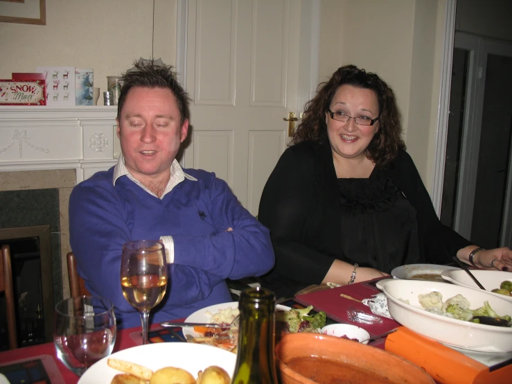 a couple of people sitting at a table