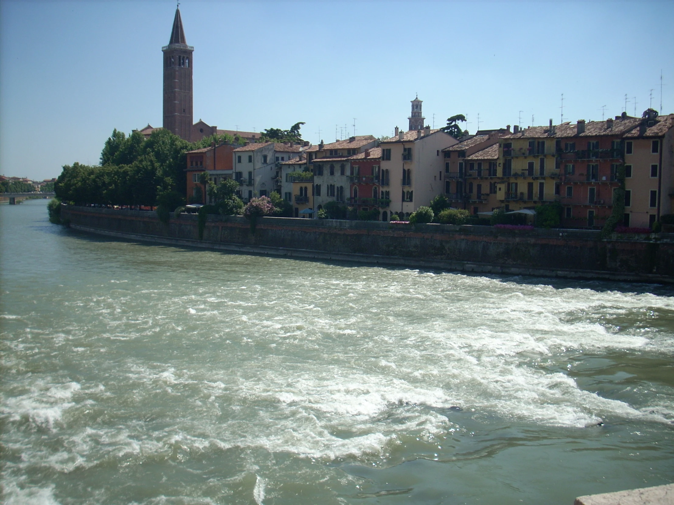 an urban scene with river running past a city