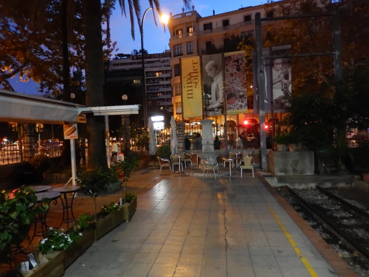 the city street is lit up at night