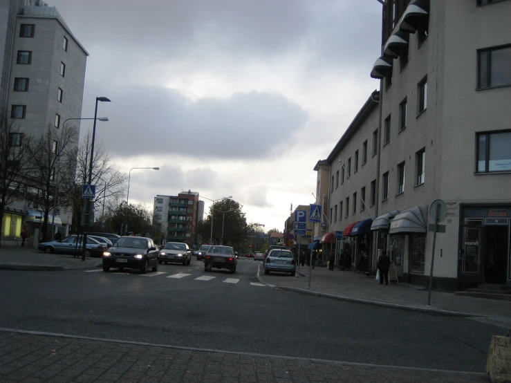 a crosswalk on an intersection between buildings