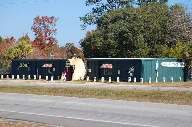 several train cars are parked next to a road