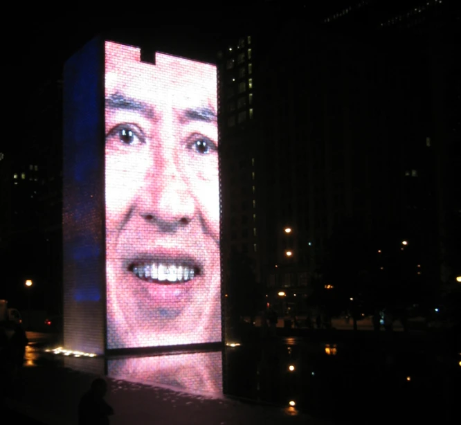 large electronic display with images projected onto large buildings