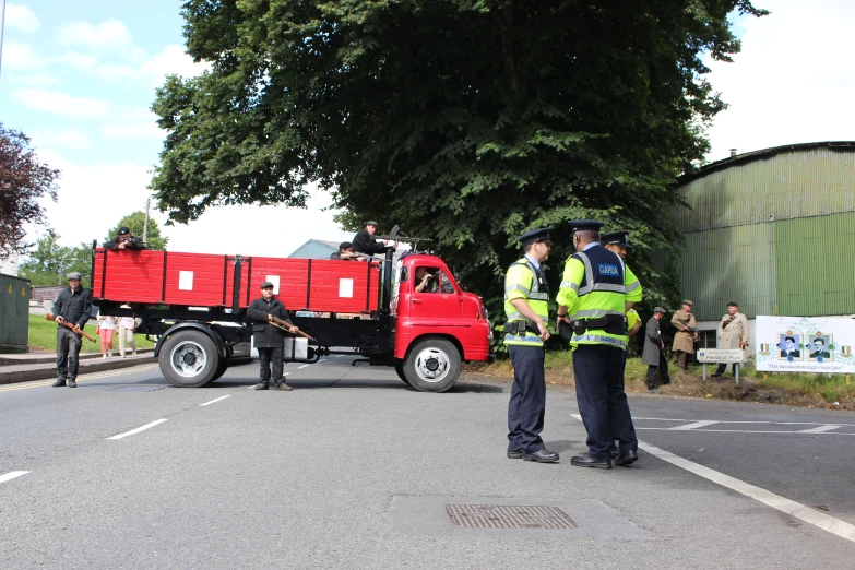 two men standing in front of a truck