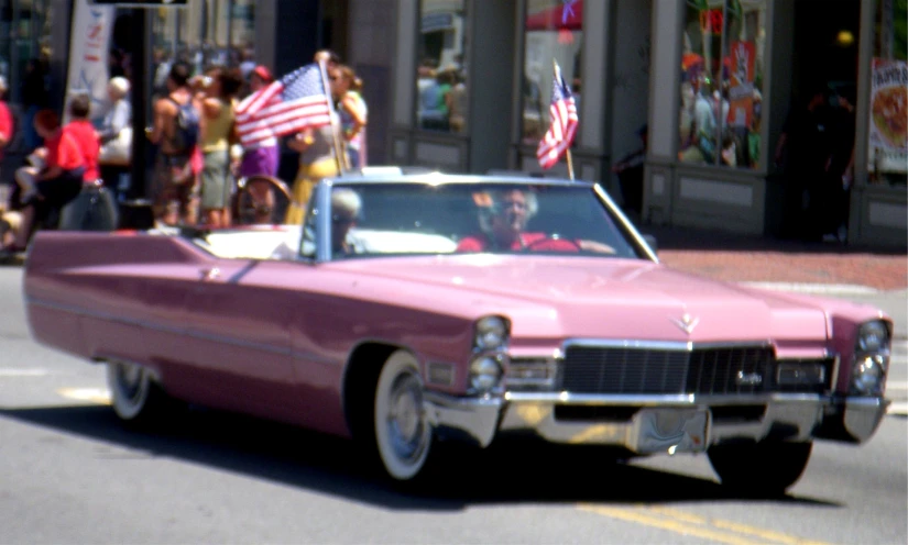 a car driving down the street on the road