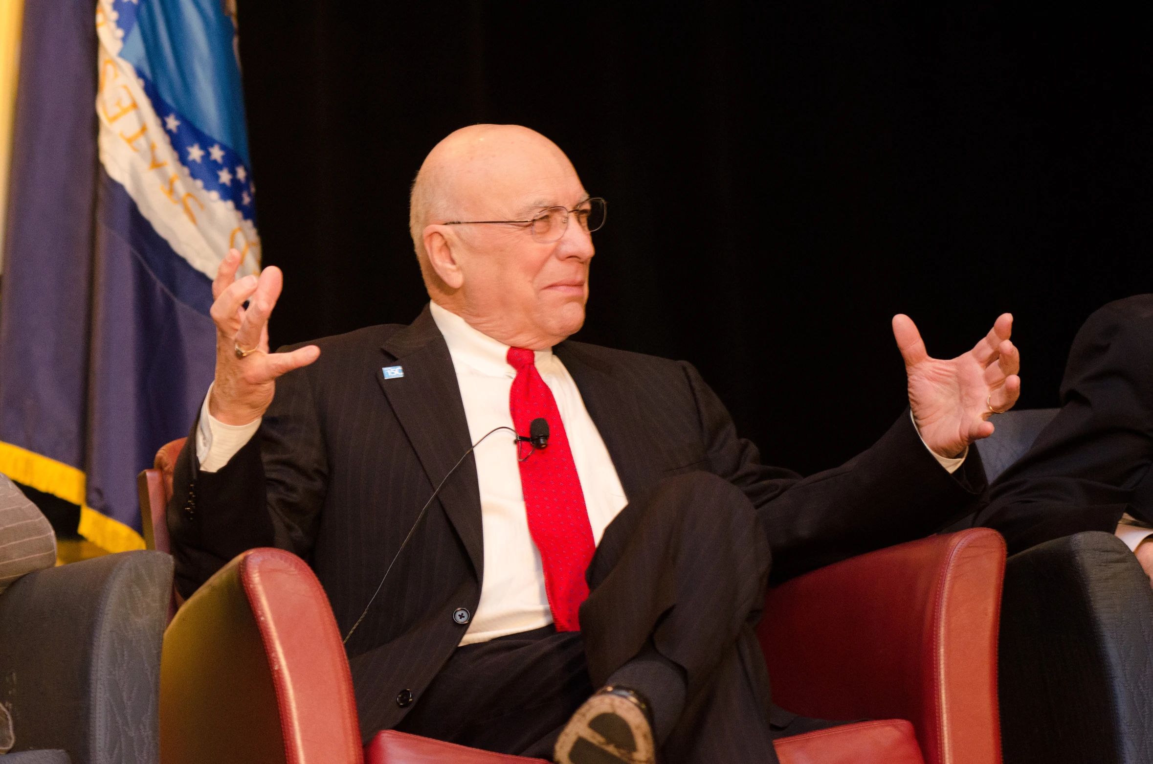 two men are speaking to one another during a business meeting