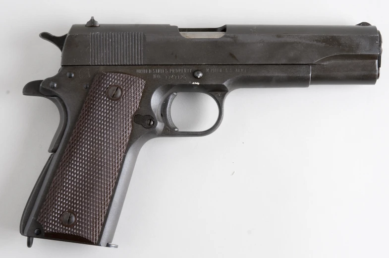 a black handgun on white background with clippings