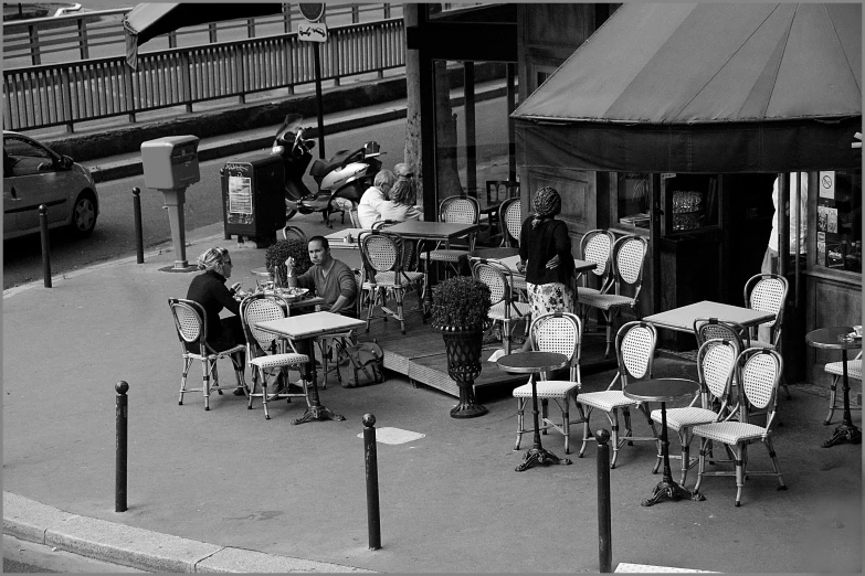 an antique po of several people around tables with clocks